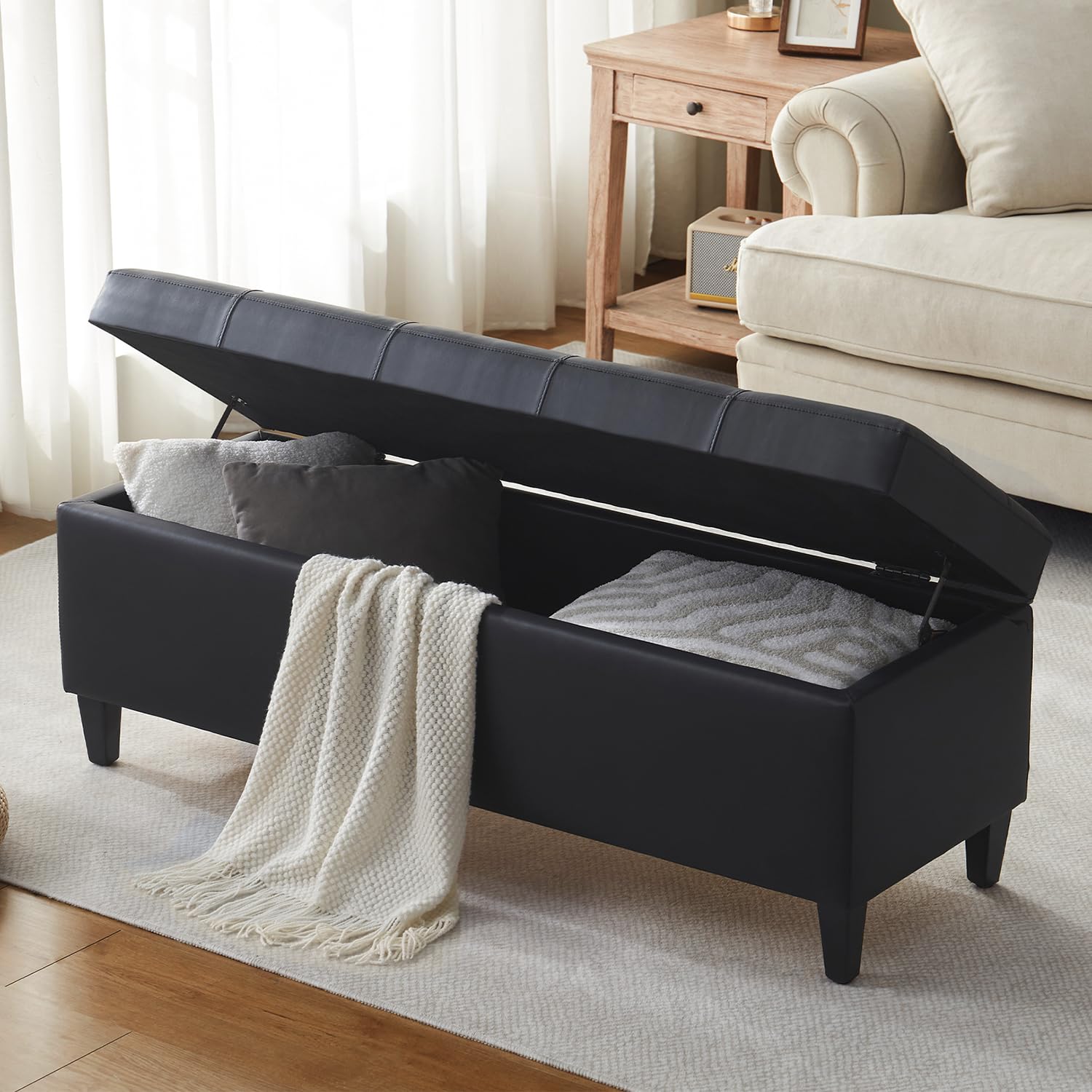 Womina 50.5 Inch Storage Ottoman Bench, Faux Leather Tufted Upholstered Bedroom Bench with Safety Hinges, Supports 300 lbs, Large Storage Bench for Living Room, Entryway (Black)